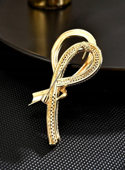 elegancka BROSZKA ozdoba do ubrań WSTĄŻKA cyrkonie kolor złoty na prezent