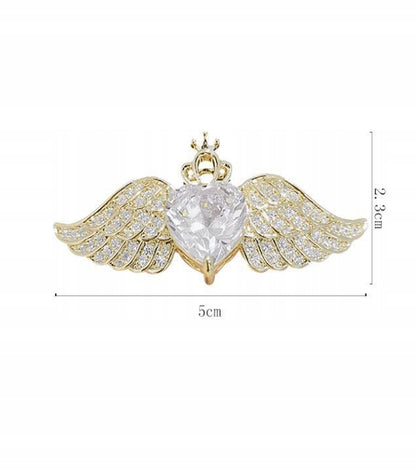 Broche corazón con circonitas – dorado