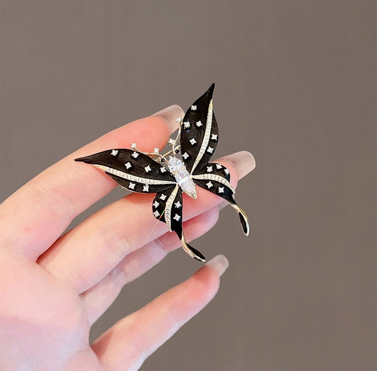 Broche papillon à zircons – doré et noir
