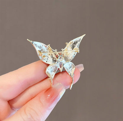 Broche papillon à zircons – doré et noir