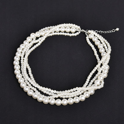 Elegant White Glass Pearl Necklace with Silver-tone Details — Classic Retro Style