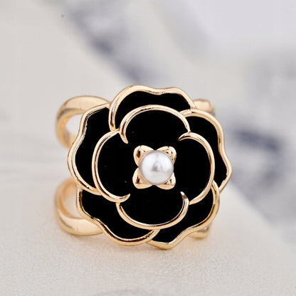 Hebilla para pañuelo con forma de flor – dorado y negro