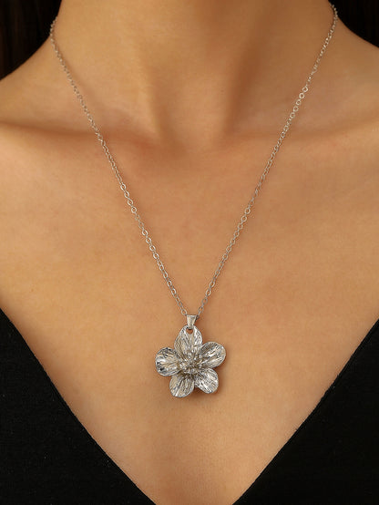 Parure : collier, boucles d’oreilles, bracelet et bague – argenté