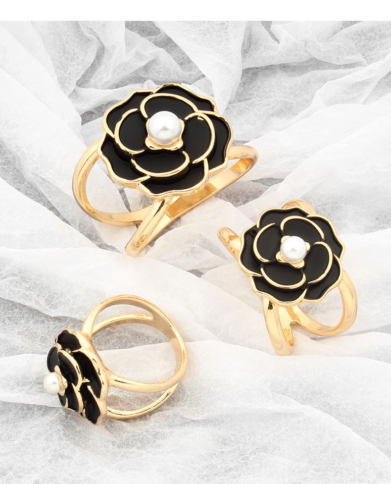 Hebilla para pañuelo con forma de flor – dorado y negro