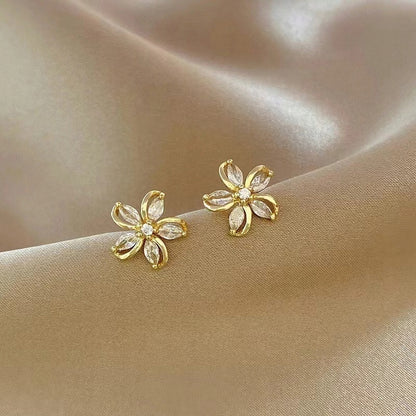Pendientes de botón con forma de flor – dorado