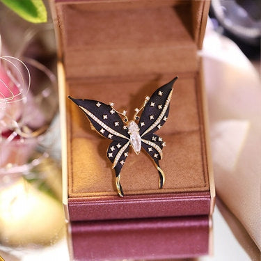 Broche papillon à zircons – doré et noir