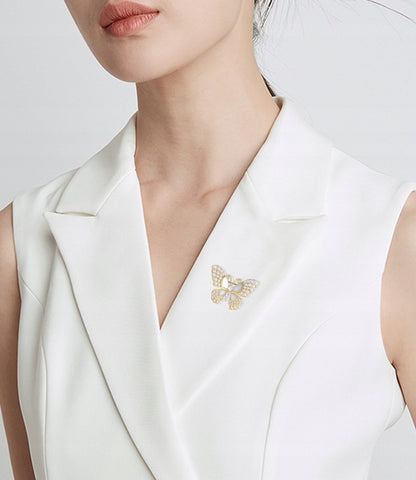 Broche papillon à zircons – doré