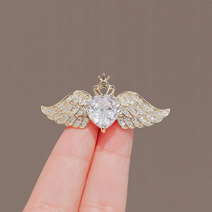 Broche corazón con circonitas – dorado