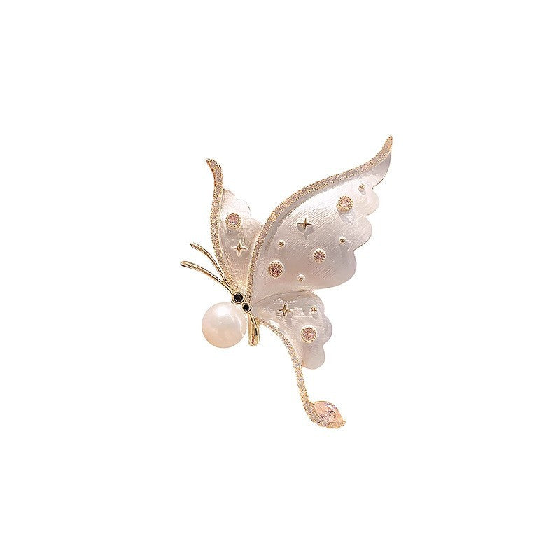 Broche papillon à zircons – doré et blanc