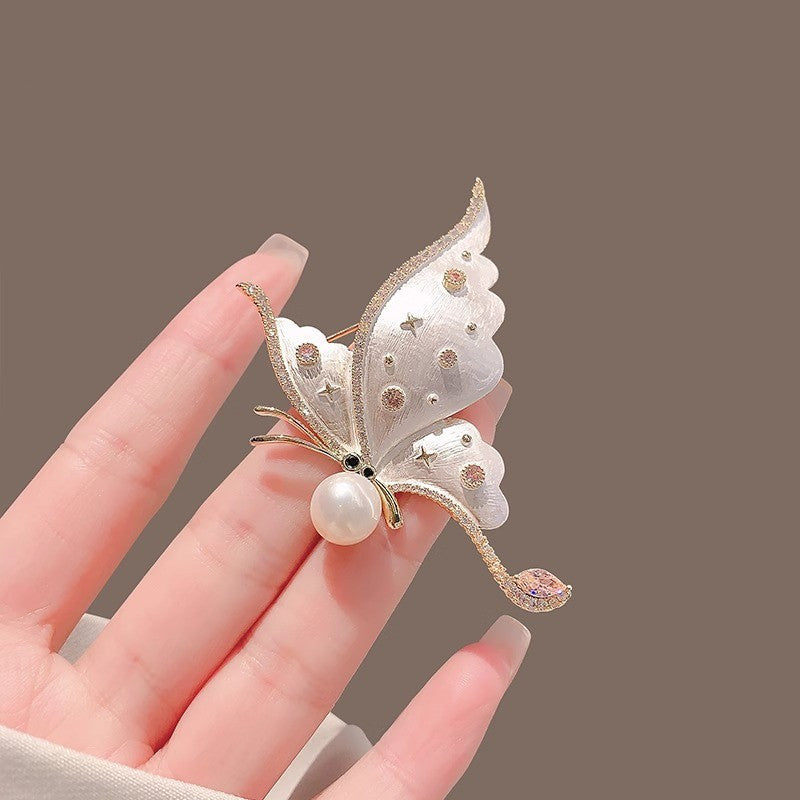 Copy of Distinctive Gold-Tone White Butterfly Brooch with Cubic Zirconia — Clothing Accessory, Leaves and a Pearl