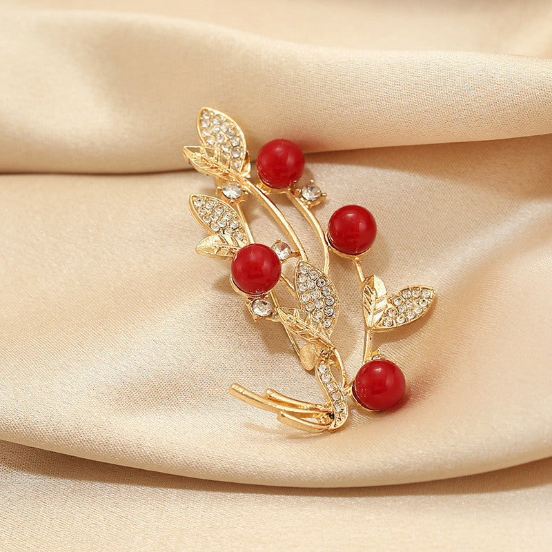 Distinctive Gold-Tone Branch Brooch with Red Pearls — Clothing Accessory, Leaves and Cubic Zirconia