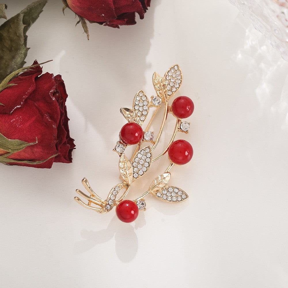 Distinctive Gold-Tone Branch Brooch with Red Pearls — Clothing Accessory, Leaves and Cubic Zirconia