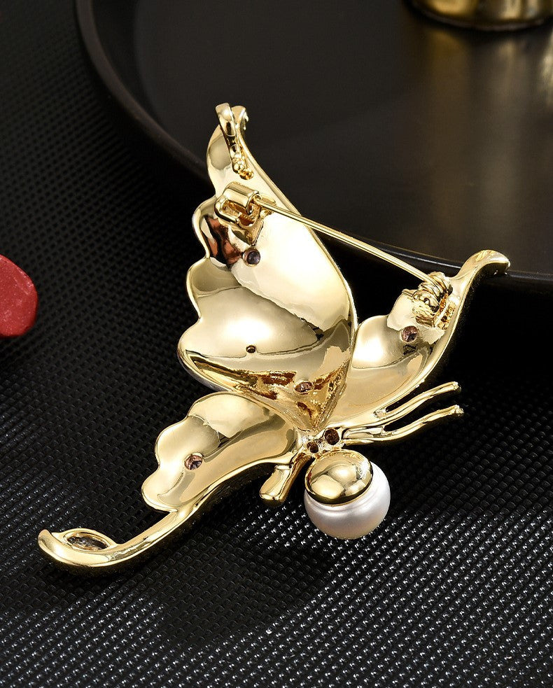 Copy of Distinctive Gold-Tone White Butterfly Brooch with Cubic Zirconia — Clothing Accessory, Leaves and a Pearl